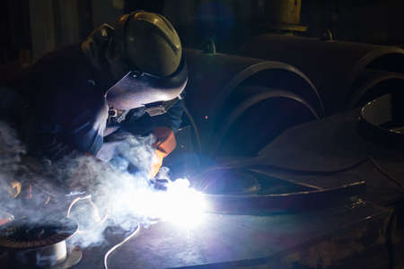 The Welding work during the night with lens flare.