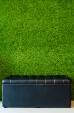 The chair has a background artificial Grass.の写真素材