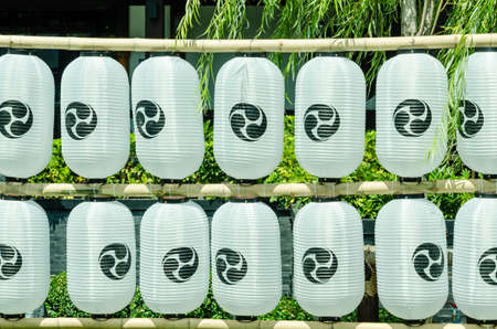 White Japanese lanterns in a rowの写真素材