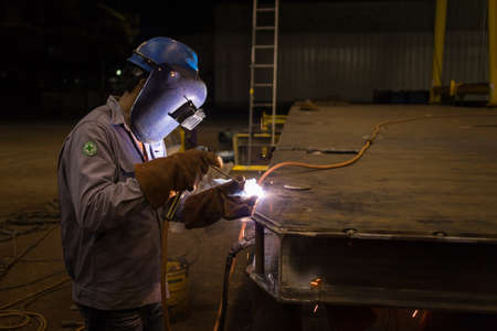 worker are welding in industrial factoryの写真素材