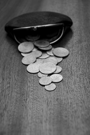 Old leather purse with coinsの写真素材