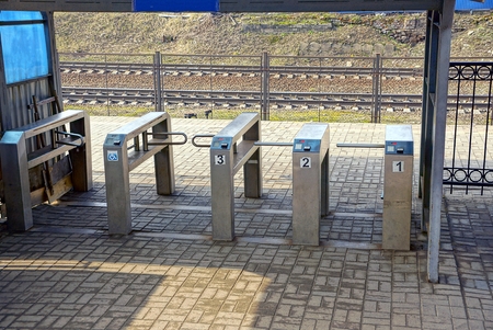 Turnstiles at a railway stationの写真素材