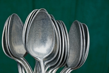 Set aluminum spoon on green backgroundの写真素材