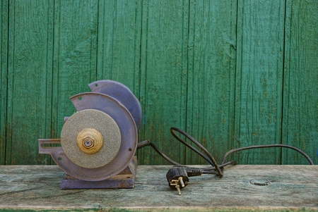 Old machine on a wooden benchの写真素材