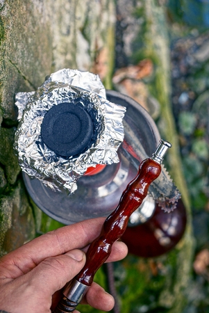 Hookah on the background of the old brick wall