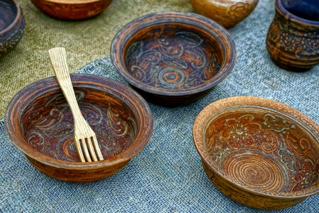 Old brown wood and pottery on clothの写真素材