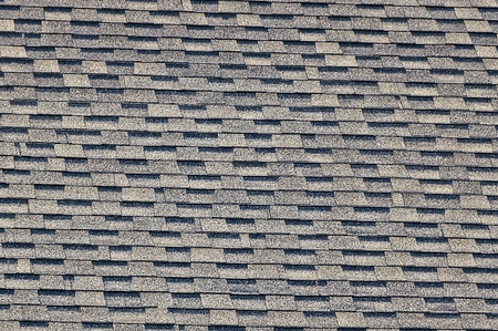 Gray black tile on the roof of a private buildingの写真素材