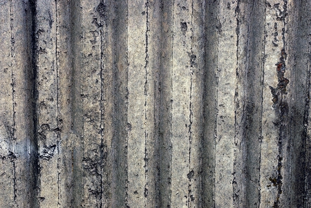 Gray ribbed background of a concrete wall part of a private buildingの写真素材