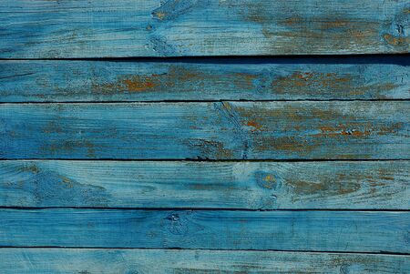 Blue background of old wooden fence boardsの写真素材