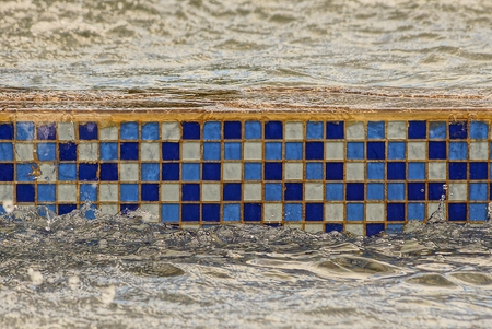 Mosaic ceramic square decorative tile in waterの写真素材