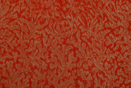 Red background with a pattern on a piece of tissue