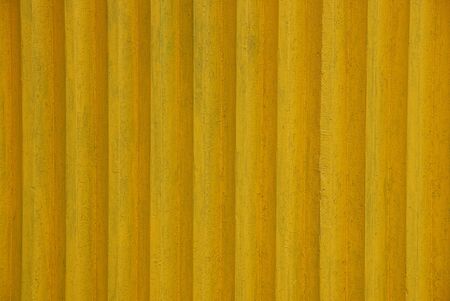 Yellow texture of old wooden fence boardsの写真素材