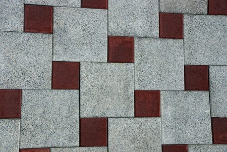Brown gray background from a fragment of stone square paving slabsの写真素材