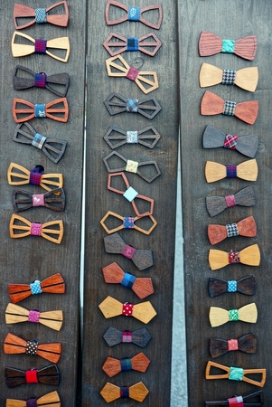 set of wooden colored butterflies on wooden brown boardsの写真素材