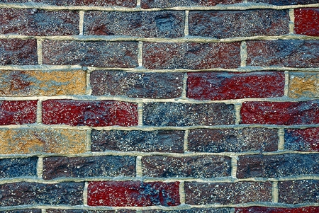 colored texture of a fragment of a brickwork on the wall of the houseの写真素材