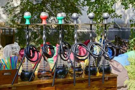 A number of hookahs stand on the table in the streetの写真素材