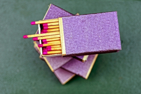 Open boxes with matches on the tableの写真素材