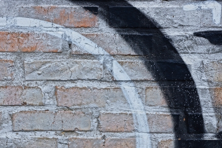 gray black texture of bricks in the wall of the houseの写真素材
