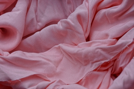 texture of a fabric of crumpled pink rose coversの写真素材