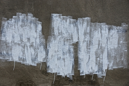gray concrete wall with white paint