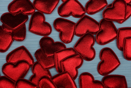 red bright background of little hearts on a blue background