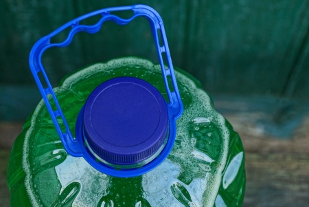 part of a bottle with a stopper and handleの写真素材