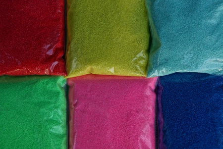 colored texture of plastic bags with fine sand