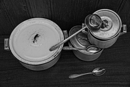 old pots with lops with scoop and spoons