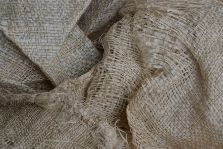 gray texture from a ragged dirty bagの写真素材