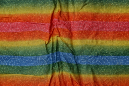 colored striped background from a fragment of crumpled matterの写真素材