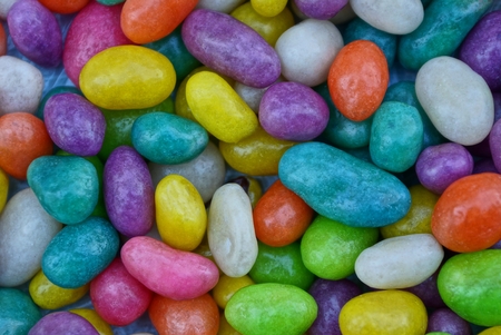colored background of a pile of small chocolates