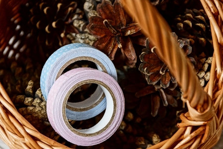 Cones, paper tape and a piece of wicker basketの写真素材