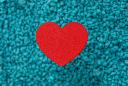 red paper heart on a blue backgroundの写真素材