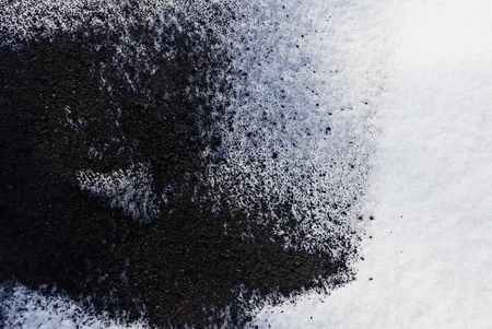 black and white texture from the ashes of a fire and snowの写真素材
