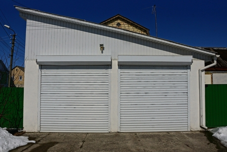 white private garage in the street near the roadの写真素材
