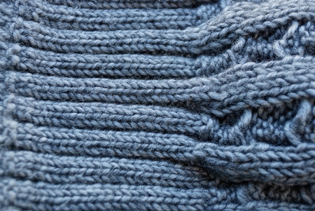 gray texture of woolen fabric with a pattern on clothesの写真素材