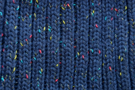 black texture of woolen fabric with a colored thread