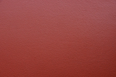 stone texture of a piece of red concrete wallの写真素材