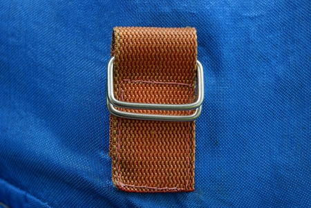 red harness with iron rings carbine on blue fabric