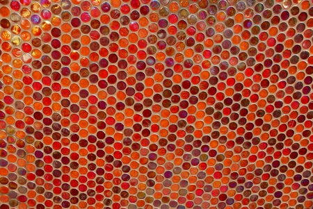 Red texture of a shallow mosaic on the wall