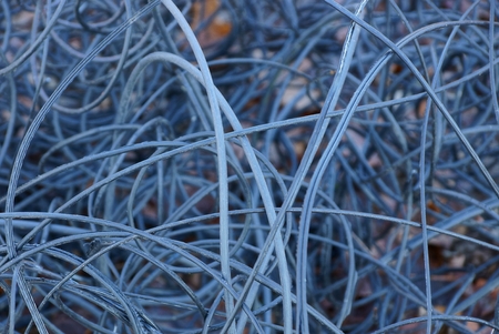 gray plastic texture of an old thin cable in a skeinの写真素材