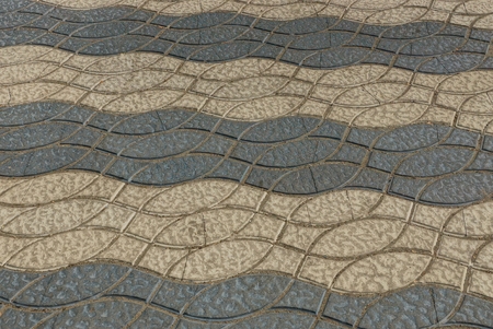 gray brown stone texture of paving slabs with a pattern