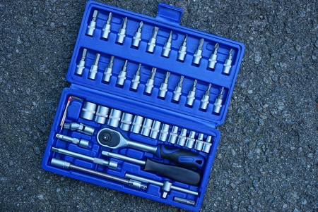 blue open box on gray asphaltの写真素材