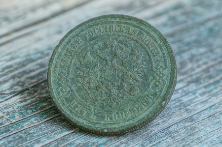 one big old green coin with an eagleの写真素材