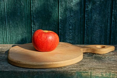 red brown wooden board against green wallの写真素材