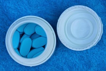 blue pills in whiteの写真素材