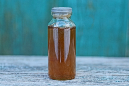rubber bottle on a green background