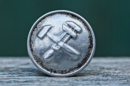 soviet metal button on gray backgroundの写真素材