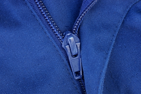 open long metal zip on blue clothesの写真素材