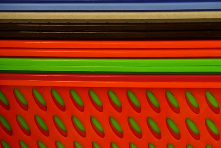 colorful bright background from a row of plastic boxesの写真素材